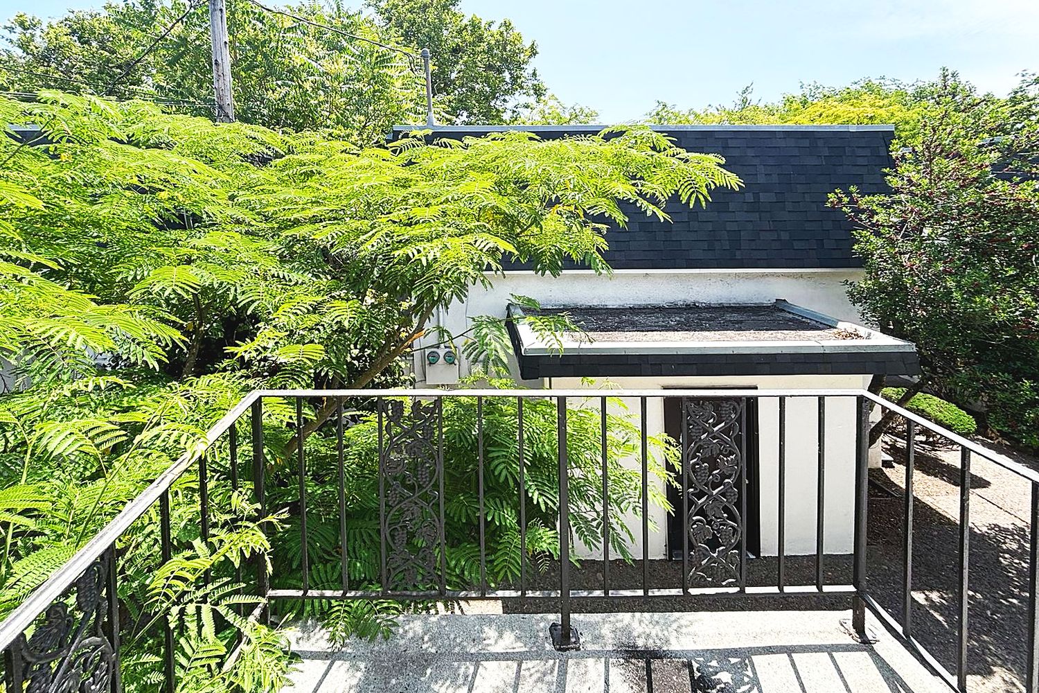 Balcony over the courtyard trees